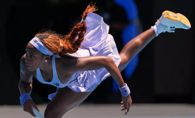 Coco Gauff of the U.S. serves to Kamilla Rakhimova of Uzbekistan during their first round match at the Australian Open tennis championship in Melbourne, Australia, Monday, Jan. 19, 2026. (AP Photo/Aaron Favila)