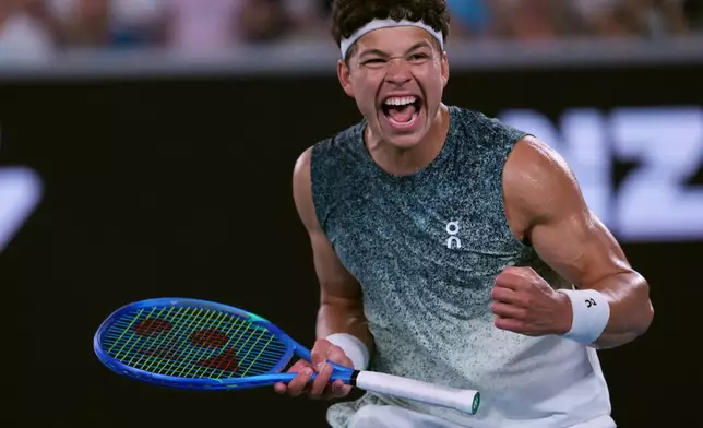 Ben Shelton of the U.S. celebrates after defeating Valentin Vacherot of Monaco in their third round match at the Australian Open tennis championship in Melbourne, Australia, Saturday, Jan. 24, 2026. (AP Photo/Aaron Favila)