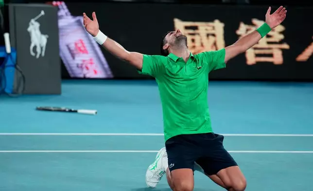 Novak Djokovic of Serbia celebrates after defeating Jannik Sinner of Italy in their semifinal match at the Australian Open tennis championship in Melbourne, Australia, early Saturday, Jan. 31, 2026. (AP Photo/Dita Alangkara)
