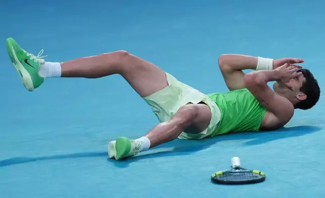 Carlos Alcaraz of Spain celebrates after defeating Alexander Zverev of Germany in their semifinal match at the Australian Open tennis championship in Melbourne, Australia, Friday, Jan. 30, 2026. (AP Photo/Aaron Favila)