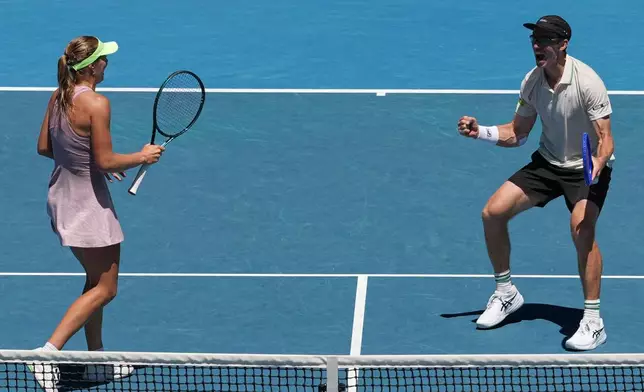 Australia's Olivia Gadecki and John Peers in action against France's Kristina Mladenovic and Manuel Guinard in the mixed doubles final at the Australian Open tennis championship in Melbourne, Australia, Friday, Jan. 30, 2026. (AP Photo/Aaron Favila)