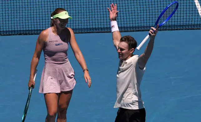 Australia's Olivia Gadecki and John Peers celebrate after defeating France's Kristina Mladenovic and Manuel Guinard in the mixed doubles final at the Australian Open tennis championship in Melbourne, Australia, Friday, Jan. 30, 2026. (AP Photo/Aaron Favila)