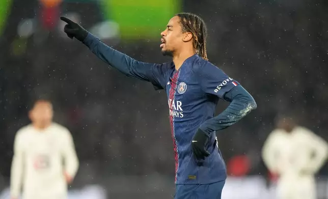 PSG's Bradley Barcola celebrates after scoring his side's third goal during the French League One soccer match between Paris Saint-Germain and Lille in Paris, France, Friday, Jan. 16, 2026. (AP Photo/Michel Euler)