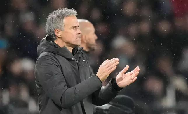 PSG's head coach Luis Enrique reacts during the French League One soccer match between Paris Saint-Germain and Lille in Paris, France, Friday, Jan. 16, 2026. (AP Photo/Michel Euler)
