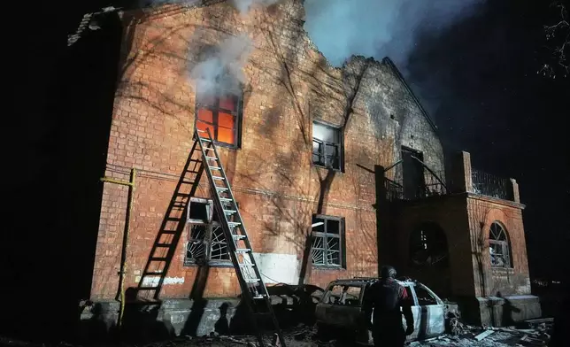 A residential building burns after a Russian strike in Kyiv, Ukraine, Friday, Jan. 9, 2026. (AP Photo/Efrem Lukatsky)