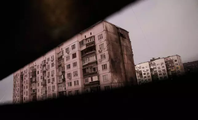 A residential building is seen damaged by a Russian strike on Kyiv, Ukraine, on Friday, Jan. 9, 2026. (AP Photo/Evgeniy Maloletka)