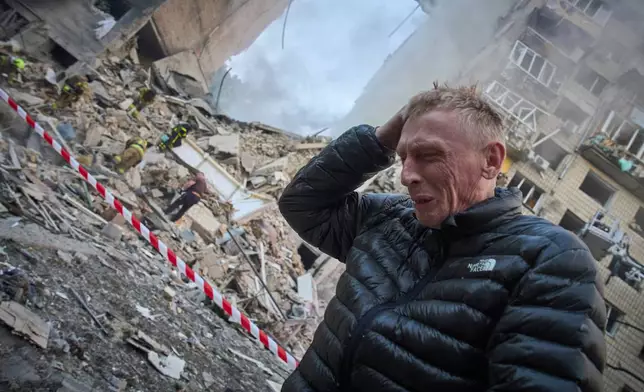 FILE - A resident reacts after a Russian missile hit a multi-storey apartment during Russia's combined missile and drone air attack in Kyiv, Ukraine, June 17, 2025. (AP Photo/Efrem Lukatsky, File)
