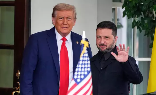FILE - President Donald Trump, left, greets Ukraine's President Volodymyr Zelenskyy as he arrives at the White House, Aug. 18, 2025, in Washington. (AP Photo/Alex Brandon, File)