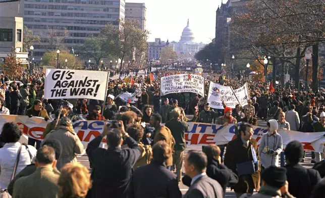 FILE - Anti-Vietnam war demonstrators mass on the Ellipse in Washington on May 9, 1970. (AP Photo/Charles Tasnadi, File)