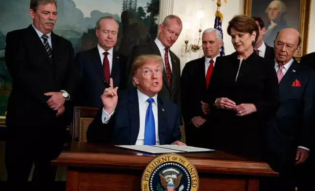 FILE - President Donald Trump speaks before he signs a presidential memorandum imposing tariffs and investment restrictions on China in the Diplomatic Reception Room of the White House, March 22, 2018, in Washington. (AP Photo/Evan Vucci, File)