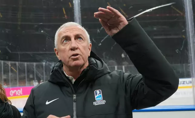 Luc Tardif, IIHF President talks to reporters at the Santa Giulia Ice Hockey Arena, in Milan, where Ice Hockey discipline of the Milan Cortina 2026 Winter Olympics will take place, in Milan, Italy, Sunday, Jan. 11, 2026. (AP Photo/Luca Bruno)