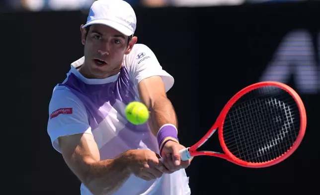 Nuno Borges of Portugal plays a backhand return to Learner Tien of the U.S. during their third round match at the Australian Open tennis championship in Melbourne, Australia, Friday, Jan. 23, 2026. (AP Photo/Dar Yasin)