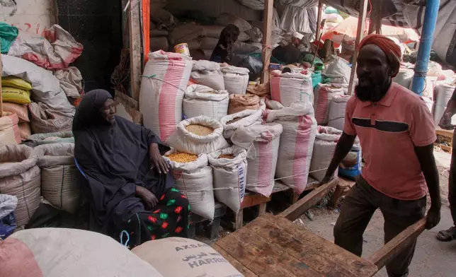 A man pulls a handcart in Mogadishu, Somalia, Thursday, Jan. 8, 2026. (AP Photo/Farah Abdi Warsameh)