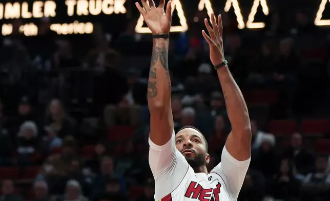 Miami Heat guard Norman Powell (24) shoots against the Portland Trail Blazers during the first half of an NBA basketball game Thursday, Jan. 22, 2026, in Portland, Ore. (AP Photo/Amanda Loman)