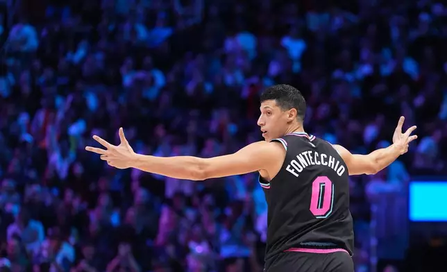 Miami Heat forward Simone Fontecchio (0) celebrates hitting a three-point shot during the first half of an NBA basketball game against the Oklahoma City Thunder, Saturday, Jan. 17, 2026, in Miami. (AP Photo/Rebecca Blackwell)