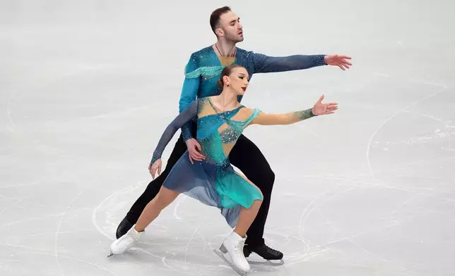 Georgia's Anastasiia Metelkina and Luka Berulava compete during the Pairs Free Skating on day two of the ISU European Figure Skating Championships in Sheffield, England, Thursday, Jan. 15, 2026. (Mike Egerton/PA via AP)