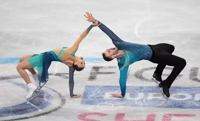 Georgia's Anastasiia Metelkina and Luka Berulava compete during the Pairs Free Skating on day two of the ISU European Figure Skating Championships in Sheffield, England, Thursday, Jan. 15, 2026. (Mike Egerton/PA via AP)