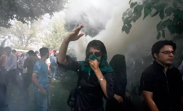 FILE - An Iranian female opposition supporter reacts as she attends a protest in Tehran, Iran, Friday, Sept. 18, 2009, in competition with government-sponsored mass rallies to mark an annual anti-Israel commemoration, the Quds Day that reflects the Persian nation's sympathy with the Palestinians. (AP Photo, File)