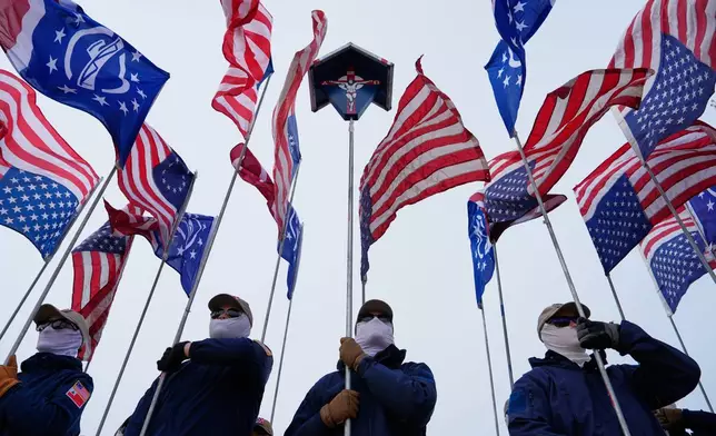 Members of the Patriot Front hold flags on the National Mall during the annual March for Life, Friday, Jan. 23, 2026, in Washington. (AP Photo/Julia Demaree Nikhinson)