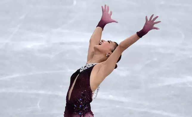 FILE - Kaori Sakamoto, of Japan, competes in the women's free skating segment at the ISU Grand Prix of Figure Skating Final in Nagoya, central Japan, Saturday, Dec. 6, 2025. (AP Photo/Hiro Komae, File)