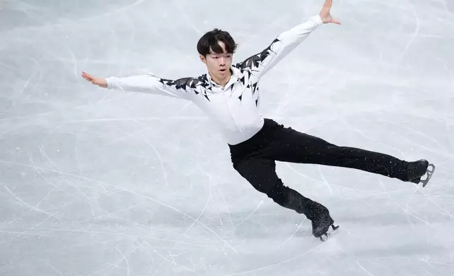 FILE - Yuma Kagiyama, of Japan, competes in the men's short program segment at the ISU Grand Prix of Figure Skating Final in Nagoya, central Japan, Thursday, Dec. 4, 2025. (AP Photo/Hiro Komae, File)