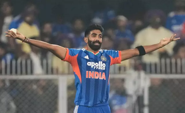 India's Jasprit Bumrah celebrates the dismissal of New Zealand's captain Mitchell Santner during the third T20 cricket match between India and New Zealand in Guwahati, India, Sunday, Jan. 25, 2026. (AP Photo/Anupam Nath)