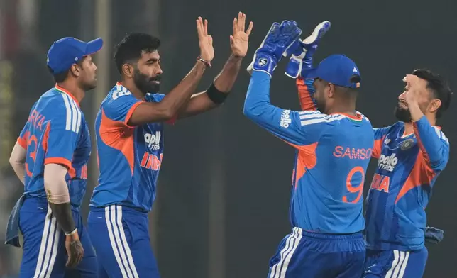 India's Jasprit Bumrah, second left, celebrates with teammates after the dismissal of New Zealand's Tim Seifert during the third T20 cricket match between India and New Zealand in Guwahati, India, Sunday, Jan. 25, 2026. (AP Photo/Anupam Nath)