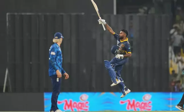 Sri Lanka's Pavan Rathnayake celebrates his century during the third ODI cricket match between England and Sri Lanka in Colombo, Sri Lanka, Tuesday, Jan. 27, 2026. (AP Photo/Eranga Jayawardena)
