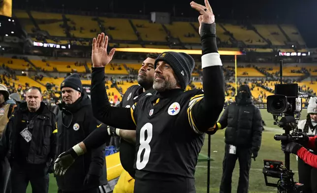 Pittsburgh Steelers quarterback Aaron Rodgers reacts to the crowd after an NFL football game against the Baltimore Ravens, Sunday, Jan. 4, 2026, in Pittsburgh. (AP Photo/Justin Berl)