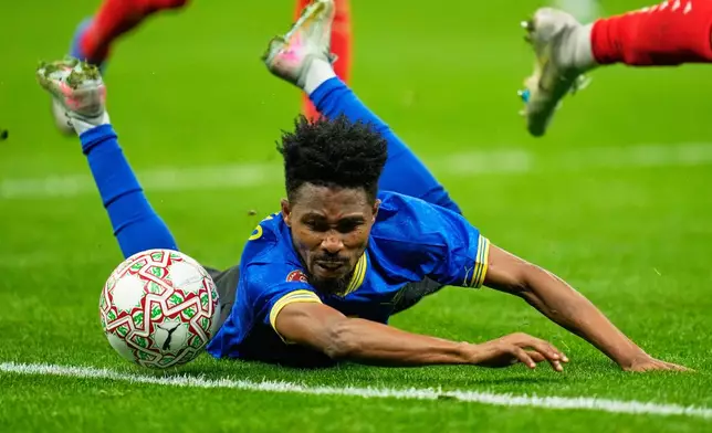 Tanzania's Iddy Nado falls while chasing the ball during the Africa Cup of Nations round of 16 soccer match between Morocco and Tanzania in Rabat, Morocco, Sunday, Jan. 4, 2026. (AP Photo/Mosa'ab Elshamy)