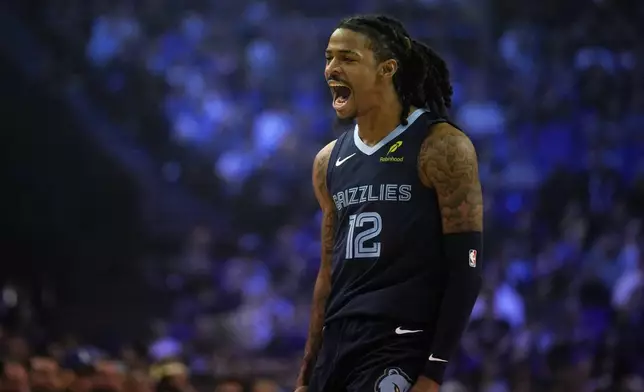 Memphis Grizzlies guard Ja Morant reacts during the second half of an NBA basketball game against the Orlando Magic Sunday, Jan. 18, 2026, in London. (AP Photo/Kin Cheung)