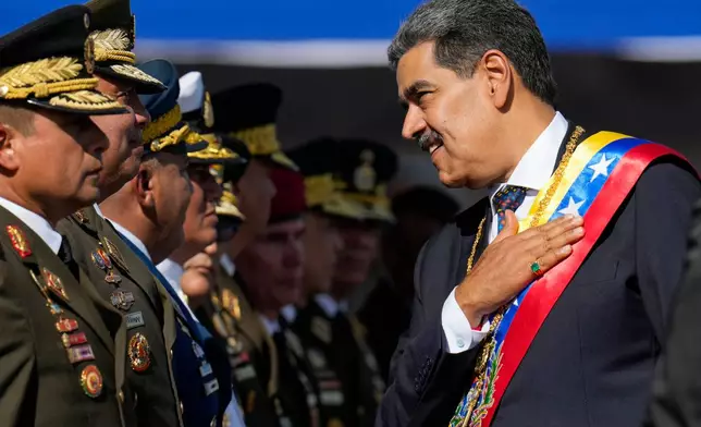 FILE - Venezuela's President Nicolas Maduro places his hand over his hear while talking to high-ranking officers during a military ceremony on his inauguration day for a third term, in Caracas, Venezuela, Jan. 10, 2025. (AP Photo/Ariana Cubillos, File)