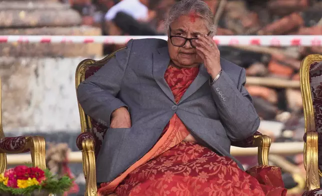 FILE - Nepal's new Prime Minister Sushila Karki waits as ministers prepare to take the oath of office administered by Nepali President Ram Chandra Poudel at the presidential building in Kathmandu, Nepal, on Sept. 15, 2025. (AP Photo/Niranjan Shrestha, File)