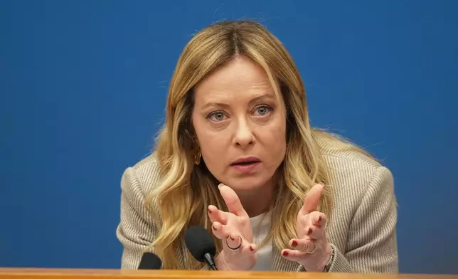 Italian Prime Minister Giorgia Meloni holds her annual start-of-the-year press conference in the press room at the Lower Chamber, in Rome, Friday, Jan. 9, 2026. (AP Photo/Andrew Medichini)