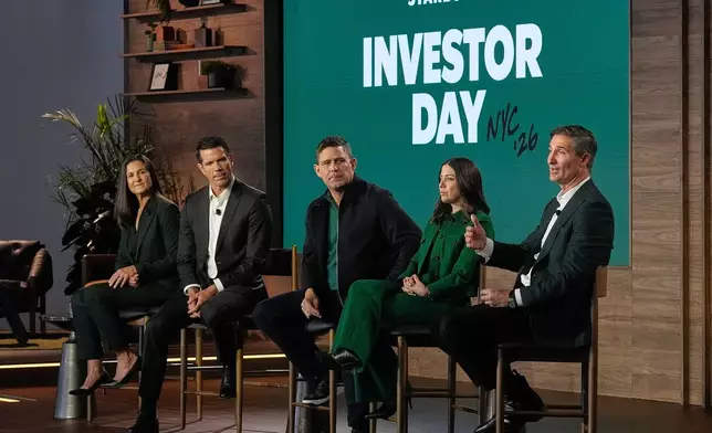 Starbucks Chairman and CEO Brian Niccol, right, speaks during the Starbucks Investor Day event, in New York, Thursday, Jan. 29, 2026. He is accompanied by, from left: CFO Cathy Smith; International CEO Brady Brewer; COO Mike Grams; and Chief Brand Officer Tressie Lieberman. (AP Photo/Richard Drew)