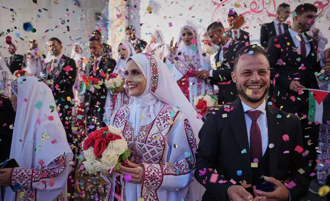FILE - Palestinian brides and grooms get married at a mass wedding ceremony in Hamad City in Khan Younis, Gaza Strip, Dec. 2, 2025. (AP Photo/Abdel Kareem Hana, File)