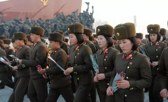 FILE - Pyongyang citizens and soldiers pay respect to the statues of President Kim Il Sung and Chairman Kim Jong Il on the 14th anniversary of Kim Jong Il's death in Pyongyang, DPRK, Dec. 17, 2025. (AP Photo/Cha Song Ho, File)