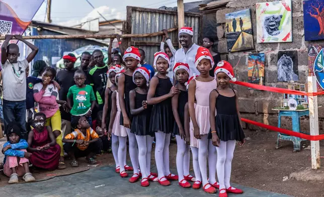 FILE - Young dancers wait to perform at a Christmas ballet event in Nairobi, Dec. 23, 2025. (AP Photo/Samson Otieno, File)