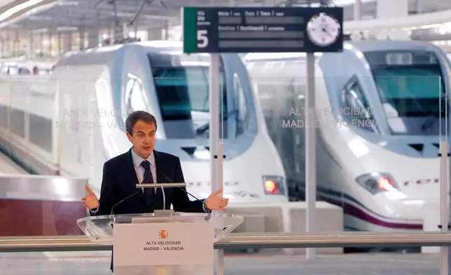 FILE - Former Spanish Prime Minister Jose Luis Rodriguez Zapatero speaks at Valencia train station, following the inaugural journey aboard a high-speed AVE train linking Madrid to Valencia, Spain, Dec. 18, 2010. (AP Photo/Alberto Saiz, File)