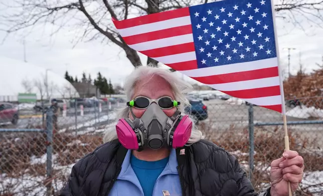 Sue Claude, 65, of Minneapolis, outside the Bishop Henry Whipple Federal Building, Tuesday, Jan. 13, 2026, in Minneapolis. (AP Photo/Adam Gray)