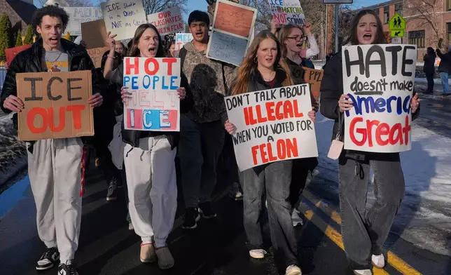 EDS NOTE: OBSCENITY - Students walk out of Roosevelt High School during a protest, Monday, Jan. 12, 2026, in Minneapolis. (AP Photo/Jen Golbeck)