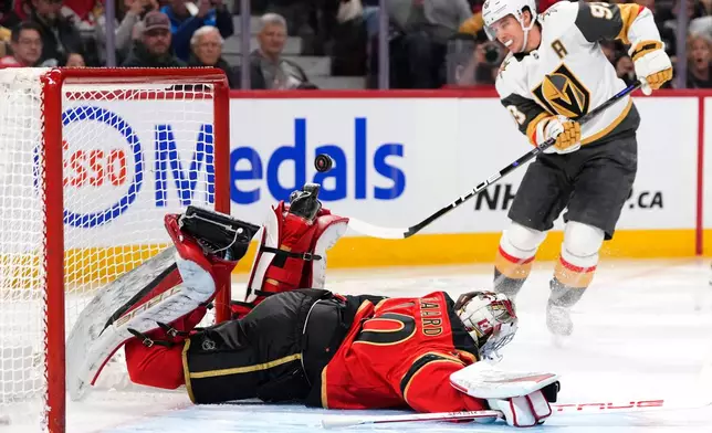 The penalty shot of Vegas Golden Knights' Mitch Marner (93) goes wide of the net of Ottawa Senators goaltender Mads Sogaard (40) during the first period of an NHL hockey game in Ottawa, on Sunday, Jan. 25, 2026. (Justin Tang/The Canadian Press via AP)