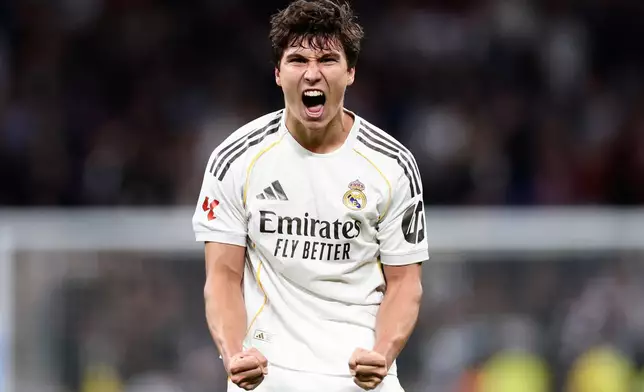 Real Madrid's Gonzalo Garcia celebrates after scoring his third and his sides fourth goal during the Spanish La Liga soccer match between Real Madrid and Real Betis Sevilla in Madrid, Spain, Sunday, Jan. 4, 2026. (AP Photo/Pablo Garcia)