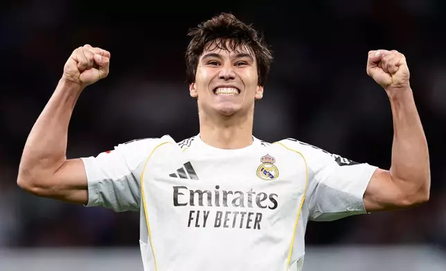 Real Madrid's Gonzalo Garcia celebrates after scoring his third and his sides fourth goal during the Spanish La Liga soccer match between Real Madrid and Real Betis Sevilla in Madrid, Spain, Sunday, Jan. 4, 2026. (AP Photo/Pablo Garcia)