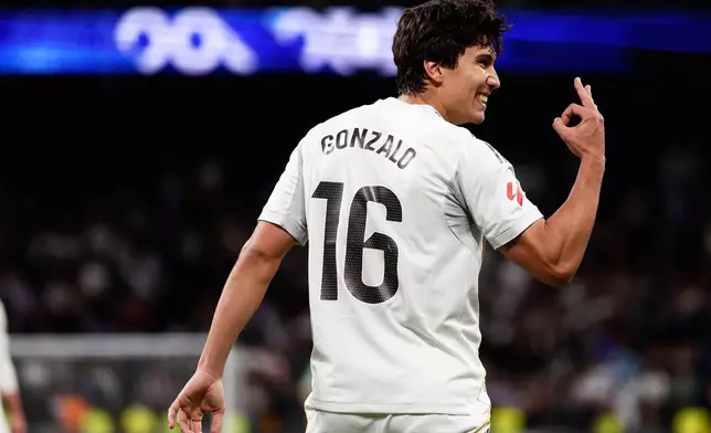 Real Madrid's Gonzalo Garcia celebrates after scoring his third and his sides fourth goal during the Spanish La Liga soccer match between Real Madrid and Real Betis Sevilla in Madrid, Spain, Sunday, Jan. 4, 2026. (AP Photo/Pablo Garcia)