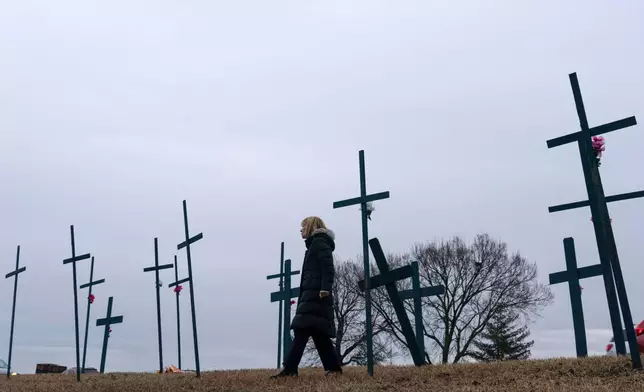 FILE - Crosses are seen at a makeshift memorial for the victims of the plane crash in the Potomac River near Ronald Reagan Washington National Airport, Jan. 31, 2025, in Arlington, Va. (AP Photo/Jose Luis Magana, File)