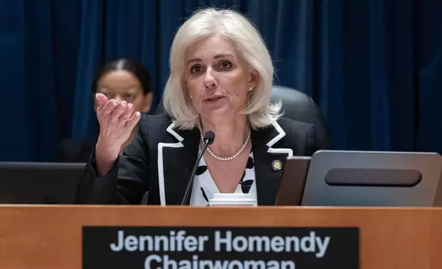 National Transportation Safety Board (NTSB) Chairwoman Jennifer Homendy presides over a NTSB hearing on the midair aircraft collision that killed 67 people near Washington Reagan National Airport, in Washington, Tuesday, Jan. 27, 2026. (AP Photo/Jose Luis Magana)