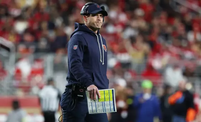 Chicago Bears head coach Ben Johnson walks on the field during the second half of an NFL football game against the San Francisco 49ers in Santa Clara, Calif., Sunday, Dec. 28, 2025. (AP Photo/Jed Jacobsohn)