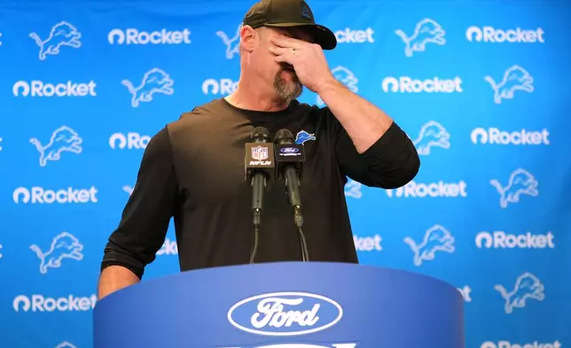 Detroit Lions head coach Dan Campbell wipes his face during a news conference after an NFL football game against the Pittsburgh Steelers, Sunday, Dec. 21, 2025, in Detroit. (AP Photo/Ryan Sun)