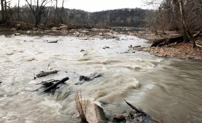 Sewage from a massive pipe rupture flows into the Potomac River in Glen Echo, Md., Friday, Jan. 23, 2026. A massive pipe that moves millions of gallons of sewage has ruptured and sent wastewater flowing into the Potomac River northwest of Washington, polluting it ahead of a major winter storm that has repair crews scrambling. (AP Photo/Cliff Owen)